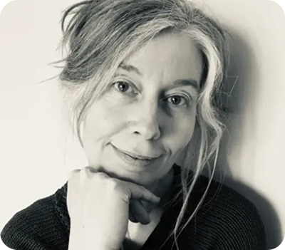 Person in a quiet moment of reflection, representing embodied awareness and presence